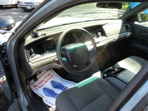 2001 Ford Crown Victoria - The interior of a 2001 Ford Crown Victoria, a floor mat with a message about pride in one's vehicle.