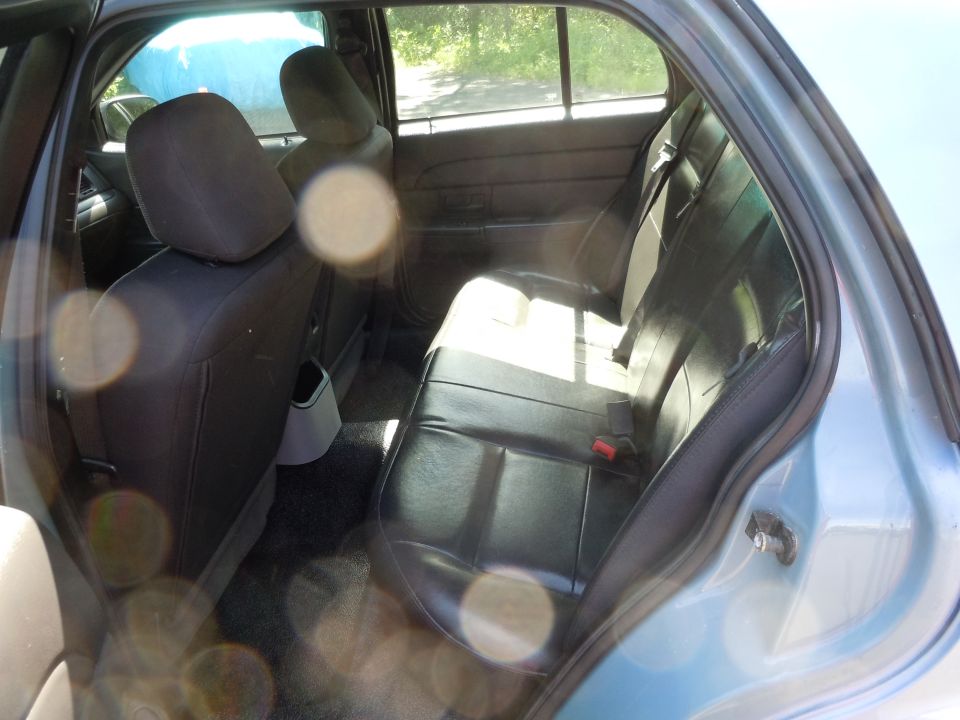 2001 Ford Crown Victoria interior showing rear seats and door panel