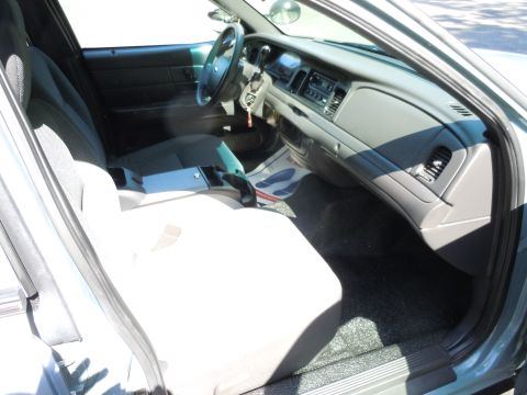2001 Ford Crown Victoria - The interior of a Ford Crown Victoria, likely a 2005 model, is shown from the passenger side.