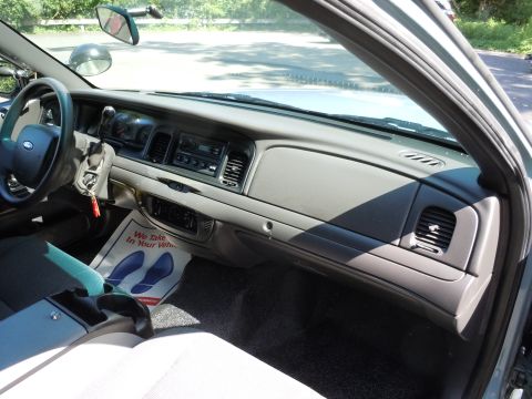 2001 Ford Crown Victoria - Interior view of a 2001 Ford Crown Victoria, highlighting the dashboard and driver's side controls.
