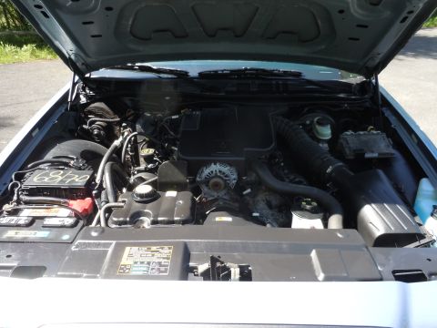 2001 Ford Crown Victoria - Engine bay of a 2001 Ford Crown Victoria, viewed from above with the hood raised.