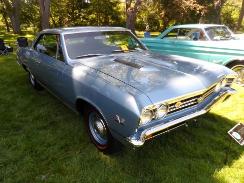 1971 Ford Ranchero - Blue 1967 Chevrolet Chevelle SS with SS badging on the grille, parked outdoors.