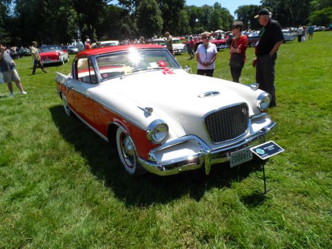1971 Ford Ranchero - This 1956 Studebaker Golden Hawk is displayed on a grassy field at an outdoor car show.