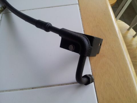1976 Ford Ranchero - This part is an air conditioning hose bracket, possibly from a vehicle, but no specific make or model can be identified.