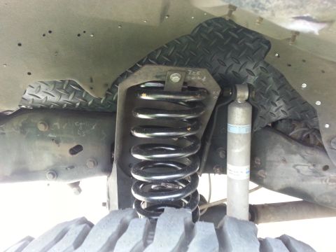 1992 Ford Bronco - Front suspension components including a coil spring and shock absorber are visible.