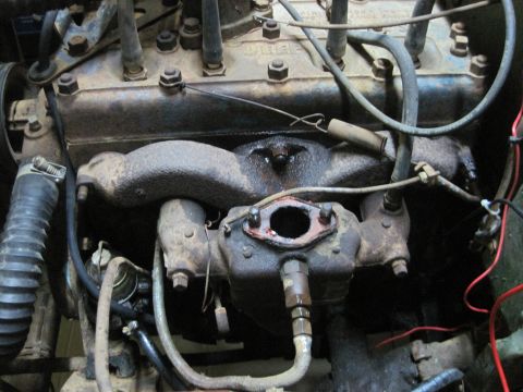 1946 Jeep CJ5 - Close-up view of an engine's internal components, including the exhaust manifold and wiring.