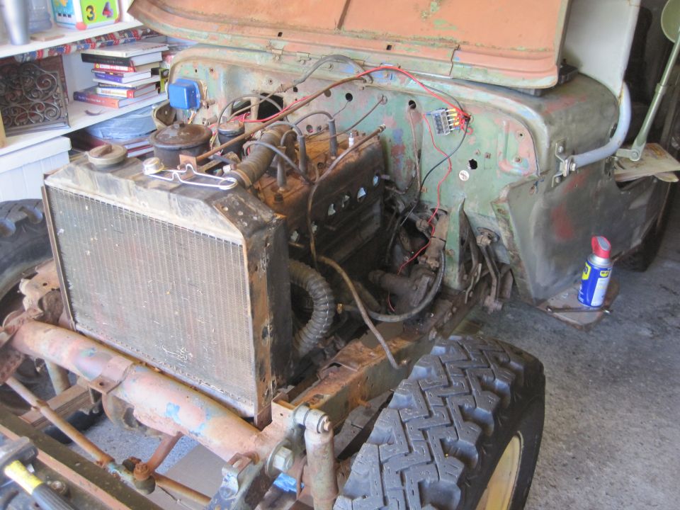 Jeep engine bay with radiator and engine components visible