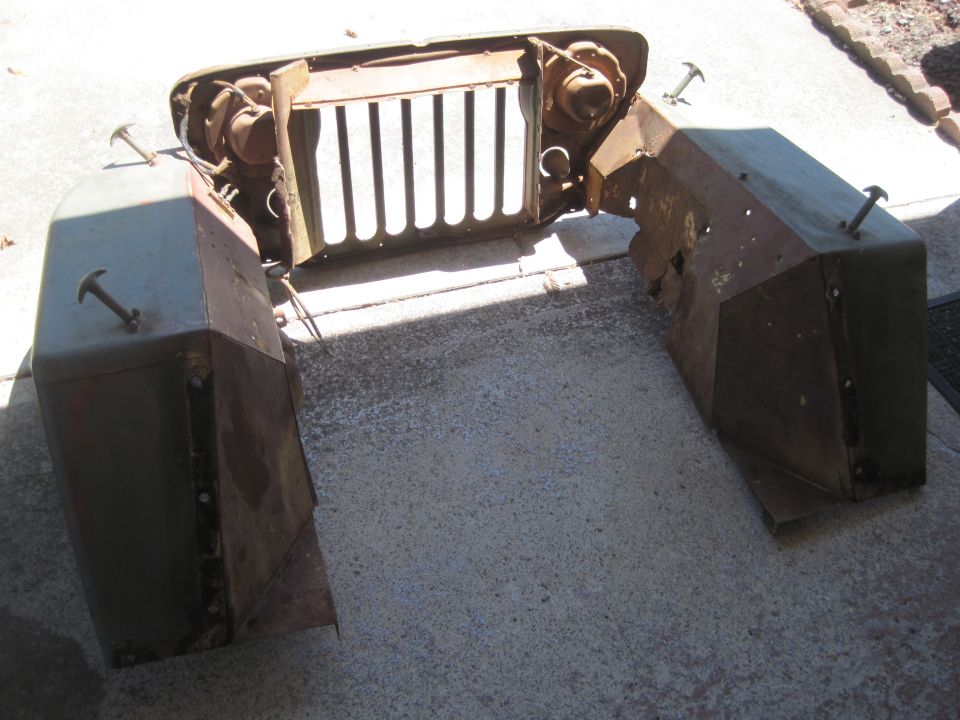 Jeep front clip with grille, headlights, and fenders disassembled