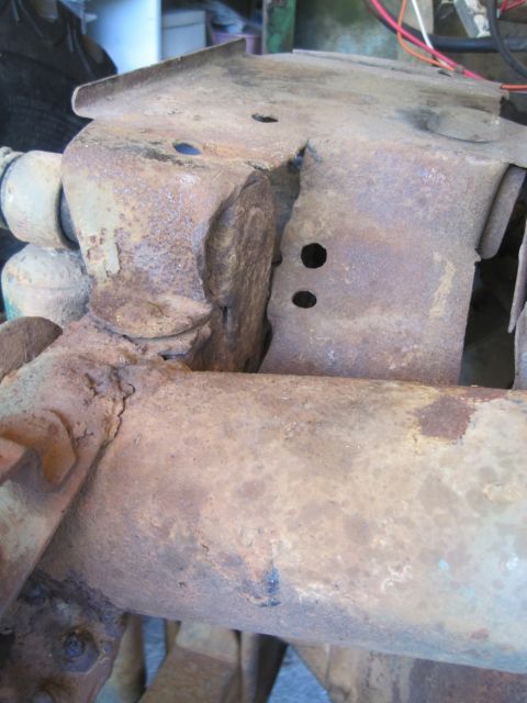 1946 Jeep Willys - Close-up view of a heavily rusted suspension component, showing signs of wear and tear.