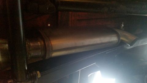 1968 Ford Bronco - Underside view of an exhaust muffler and pipe. The Supermotors.net logo is visible in the lower right corner.