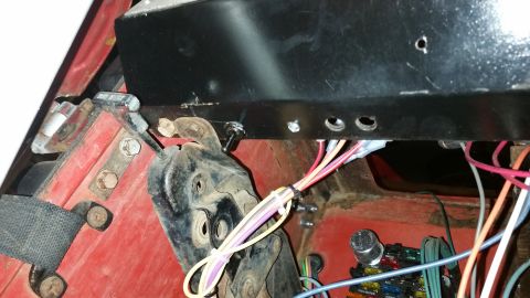 1968 Ford Bronco - Close-up of vehicle interior showing wiring and mechanical components.