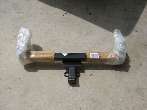 1994 Ford Bronco - Receiver hitch, wrapped for protection, sits on a concrete surface.