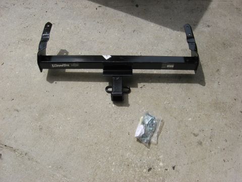 1994 Ford Bronco - Draw-Tite trailer hitch receiver and hardware shown on a concrete surface.