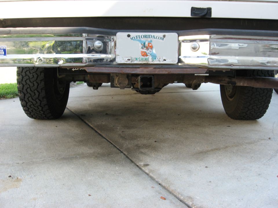 1994 Ford Bronco rear bumper, hitch, and tires. Florida license plate visible