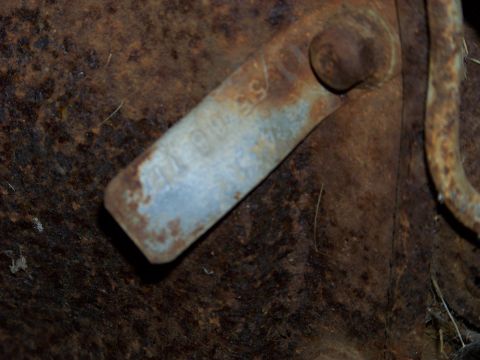 1999 Mercury Grand Marquis - A close-up view of a corroded metal component, possibly from a vehicle's undercarriage.