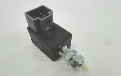 2008 Hyundai Accent - A close-up view of an electrical connector with a threaded mounting stud and securing nuts.