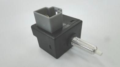 2008 Hyundai Accent - A black brake light switch with a gray electrical connector and a silver threaded plunger is shown against a white background.