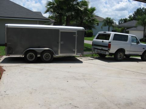 1994 Ford Bronco - Wells cargo dual axle enclosed trailer with a gutter machine mounted inside. The PO had the roof chopped and lowered to fit in a garage.