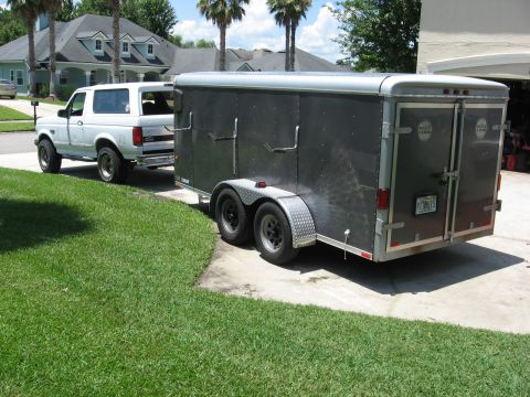 1994 Ford Bronco - Wells cargo dual axle enclosed trailer with a gutter machine mounted inside. The PO had the roof chopped and lowered to fit in a garage.