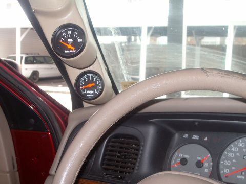 2004 Ford Crown Victoria - Aftermarket oil and RPM gauges are visible on the A-pillar inside the vehicle.