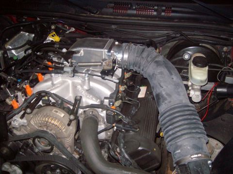 2004 Ford Crown Victoria - Close-up view of a vehicle's engine bay, showing various components and wiring.