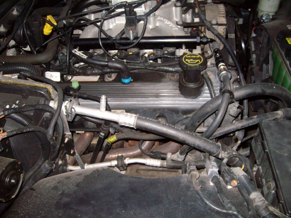 Engine bay with oil cap reading SAE 5W-30