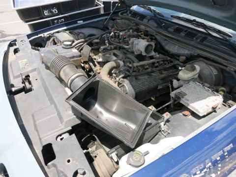 1991 Ford LTD Crown Victoria - Engine bay of a 1991 Ford Crown Victoria LTD with the air filter housing removed.