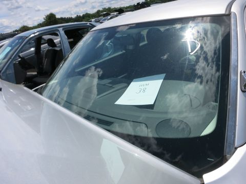 1991 Ford LTD Crown Victoria - A white car's front end is visible, with a paper tag on the windshield. Other vehicles are parked nearby.