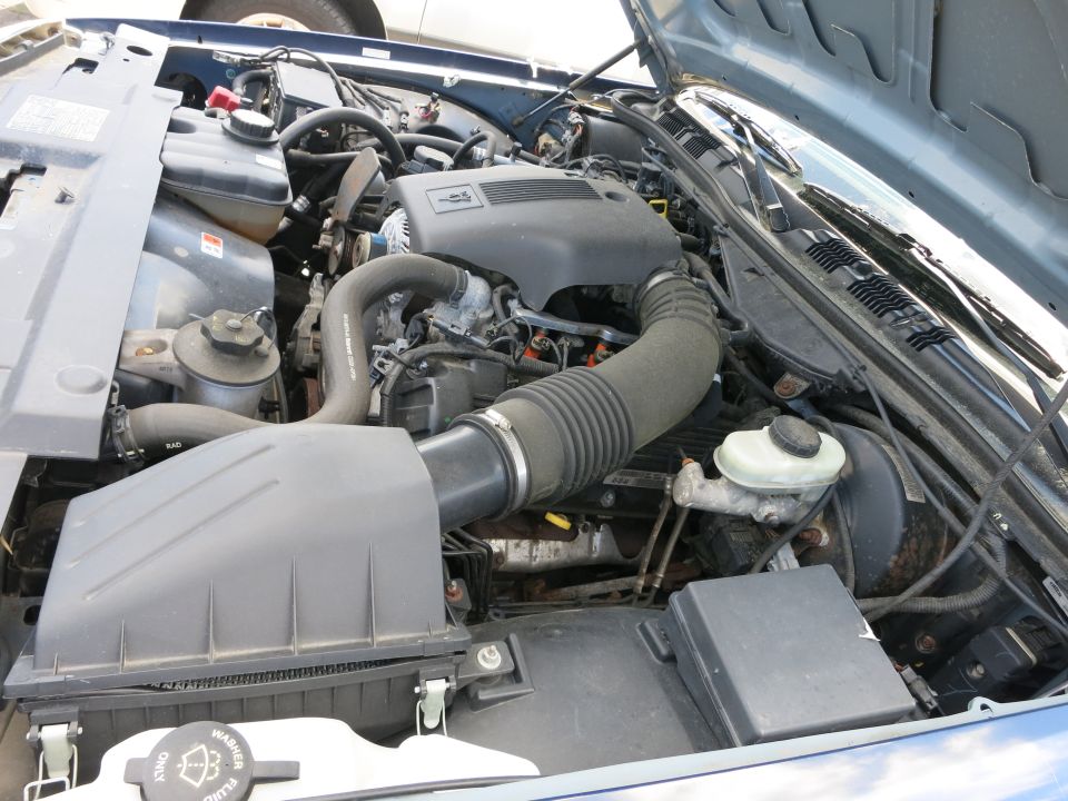 Blue 1991 Ford Crown Victoria LTD engine bay with hood open, showing engine components and hoses