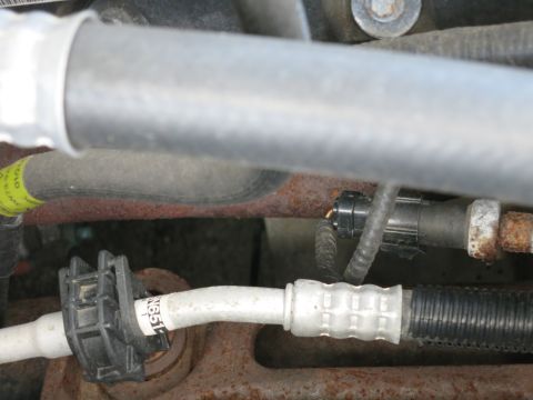 1991 Ford LTD Crown Victoria - Automotive AC lines and connectors are visible in this close-up view.
