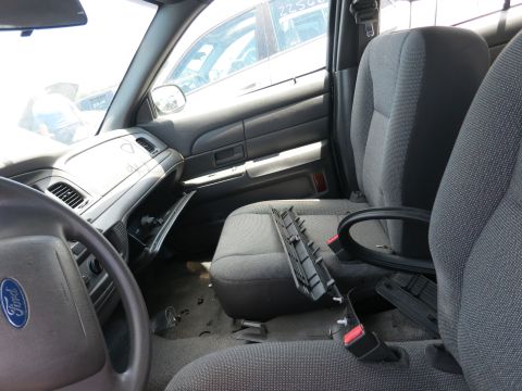 1991 Ford LTD Crown Victoria - The interior of a 1991 Ford Crown Victoria LTD, the dashboard, seats, and door panel.