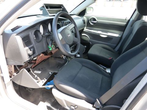 1991 Ford LTD Crown Victoria - Car interior with damaged dashboard and seats visible.