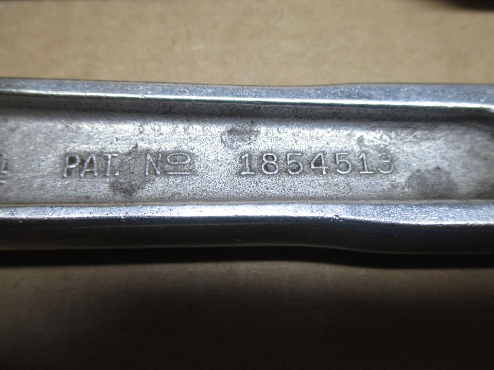Metal part with stamped text "PAT. NO 1854513"