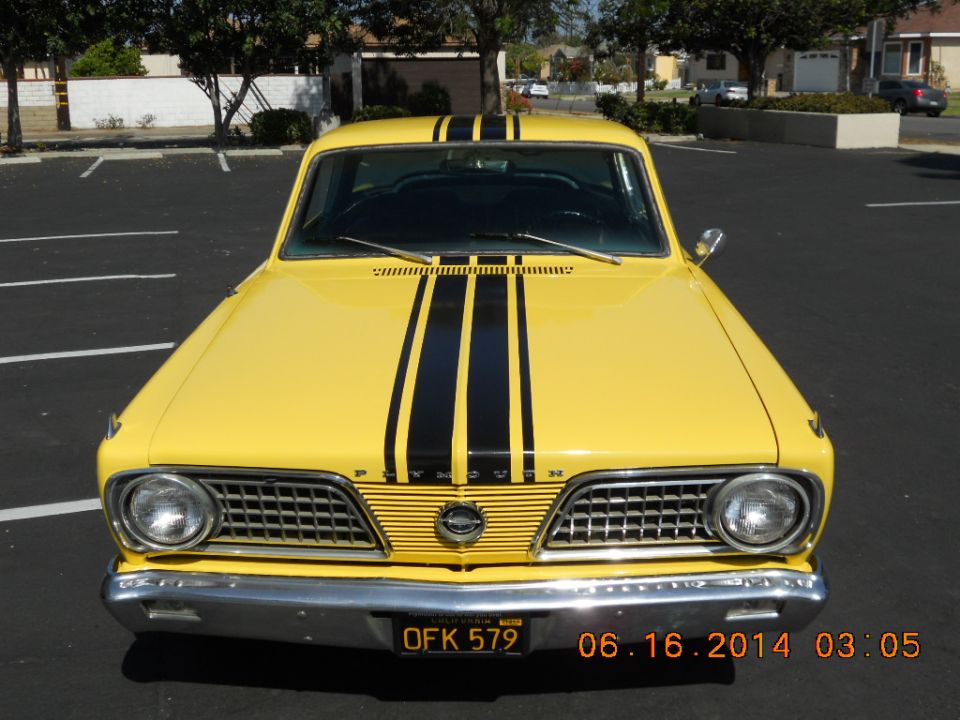 Yellow 1966 Plymouth Barracuda front view with black racing stripes