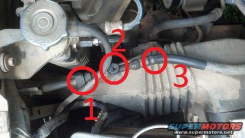 1994 Ford Bronco - Close-up view of AC system components in a vehicle, with specific connection points highlighted.