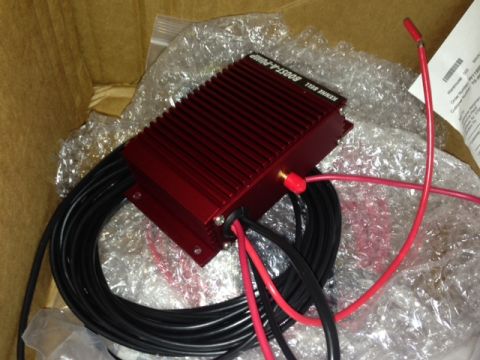 2002 Ford Mustang - Kenne Bell Boost-a-Pump unit with associated wiring, partially unwrapped from bubble wrap.