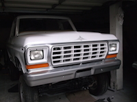 1979 Ford Bronco - This white Ford Bronco from 1978 is shown from the front, its distinctive grille.