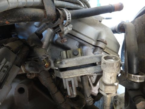1993 Ford Taurus - Close-up view of various engine parts, including hoses and electrical connectors.