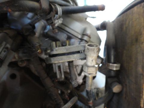 1993 Ford Taurus - Engine bay detail showing various hoses and electrical connections.