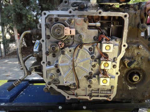 1993 Ford Taurus - Close-up of an automatic transmission valve body, showing internal components and wiring.