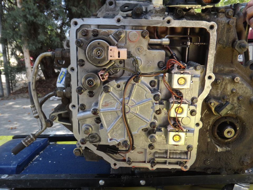 Automatic transmission valve body with electrical connectors and hydraulic lines attached