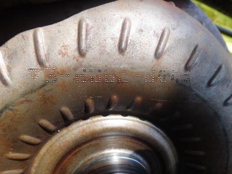 1993 Ford Taurus - A close-up view of a metal component, showing stamped alphanumeric characters.