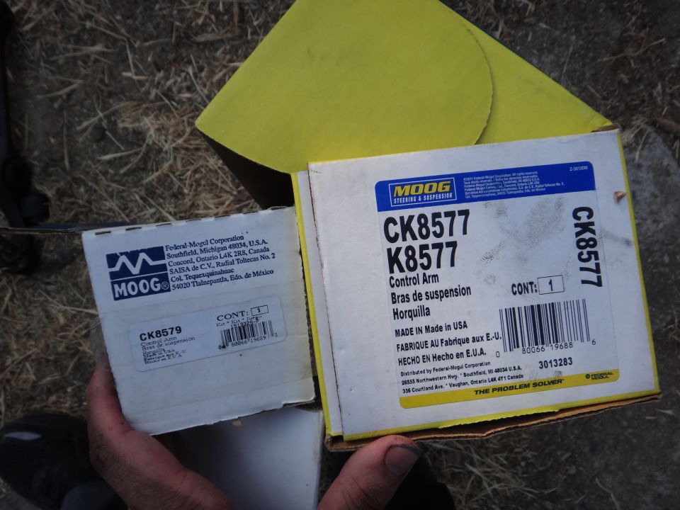 Two Moog control arm boxes, one labeled CK8577, the other CK8579