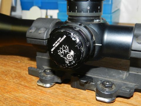 1996 Ford Bronco - Close-up of a scope with a logo and website watermark visible.