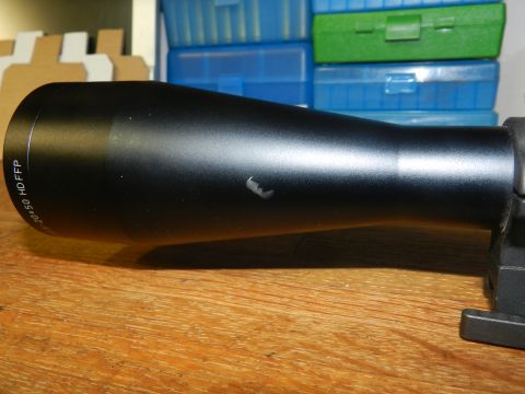 1996 Ford Bronco - Close-up of a rifle scope with visible magnification and reticle information.