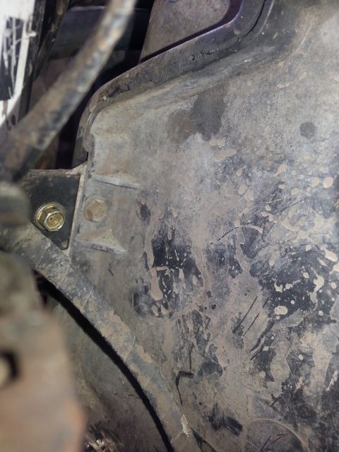 1992 Ford Bronco - Mounting bracket for a vehicle's evaporator box, showing dirt and wear.