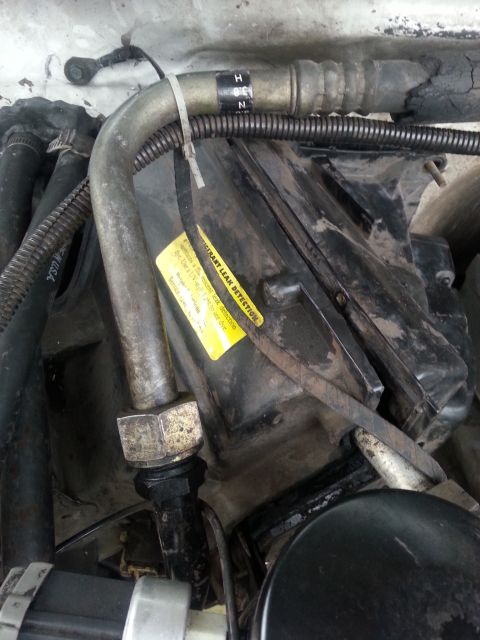 1992 Ford Bronco - all of the screws are removed and so is the nut holding box to the firewall. I'm able to start separating the it..but it's stuck...