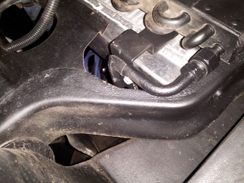 1976 Ford Ranchero - Close-up view of an air conditioning line and bracket assembly, likely from a vehicle's engine bay.