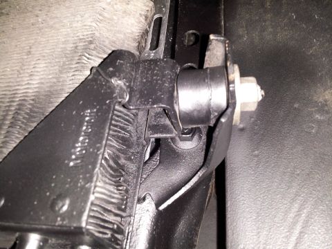 1976 Ford Ranchero - Close-up of a radiator support bracket, possibly from a Ford vehicle.