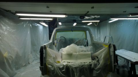1983 Ford Bronco - A 1983 Ford Bronco is prepared for painting inside a spray booth.